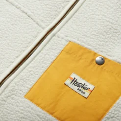 Howler Brothers Chisos Fleece Vest: Leche Con Cafe -Clothing Store F22 Vests Chisos Leche Con Cafe Detail 1000x1000 crop center.progressive 31677.1665524701